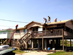 Offering a hand, roofing a house, LaFourche Parish, Louisiana 2006-03-27
